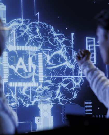 Computer scientists brainstorm ways to use AI cognitive computing to extract usable information from complex data. Data center employees implement artificial intelligence to process massive datasets