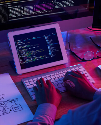 Programmer working at IT company office late at night